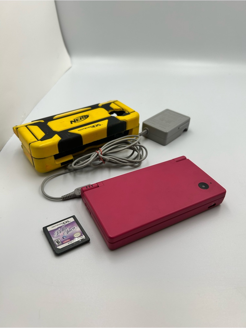 Bright Pink Nintendo DS Lite with Game Cartridge